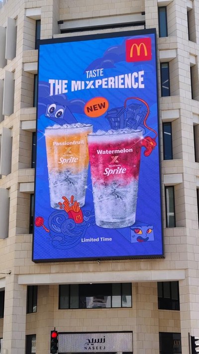 McDonald's digital OOH board in Doha reading Taste The Mixperience, two Sprite mix drinks